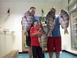Jerry Coombs with Keegan and the rest of their Sheepshead catch including his 13.42 pound 27-incher!