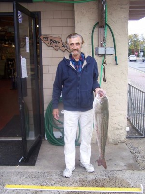 Gus Baroutas caught this 20.8-pound striper off the beach before weighing it in at The Bait Shop in Bradley Beach.