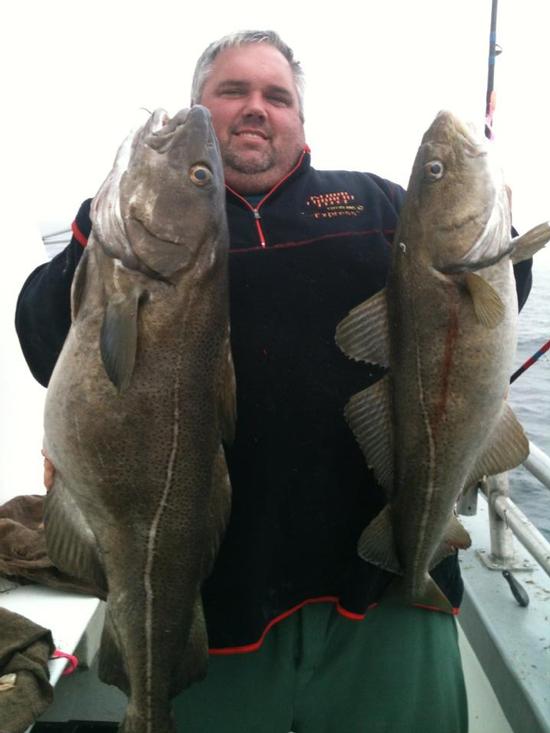 Capt. Scott Allen of the Island Current with a monster 35-pound cod and another teen-sized fish during Monday's trip off Block Island.