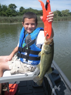 Bryan Henry, age 6 with his first ever Largemouth Bass, caught in Suffolk County.