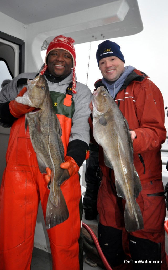 First mate Randy Brown (left) and Chris Megan showed off a couple of keeper cod at the end of the trip. By occasionally leaving a rod unattended in a rod holder, Randy outfished the editorial staff of OTW.