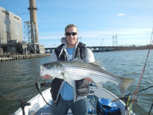 Anthony Sepe holds a 32-inch holdover bass caught in the Housatonic River. April fishing has been excellent in the Housatonic, with many schoolies and a few bigger bass over 20 pounds mixed in, according to the guys at Hook Set Fishing.