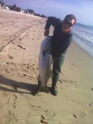 Peter Mattareese with his new personal best bass of 51 inches, caught Monday at Revere Beach on a Sebile Stick Shad.