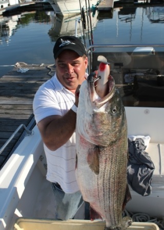 Russ Burgess with a monster 50-pound striper.