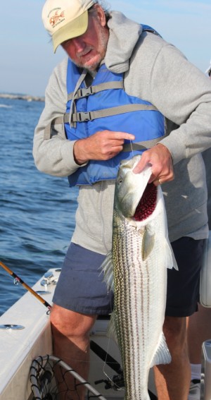 Carl Vinning of Somerville holds proof that the Harbor has been hot!