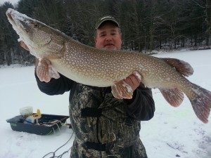 Mike Dumais with a personal-best 24-pound, 12-ounce pike he recently caught out of the Androscoggin River in Maine.
