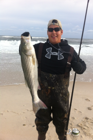 Joe Mercado caught his first striper last night off Smith's Point on a diamond jig.