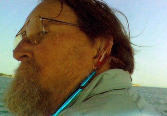 Pops poses for a photo after hooking himself in the ear with a striper plug while out fishing with his close friend &ldquo;Predator&rdquo; Phil. After Phil removed the hook, Pops kept right on fishing. 