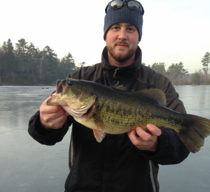 Richie Archibald of Monahan Marine with his 5-pound bass which took top prize in a central mass fishing derby over the weekend.