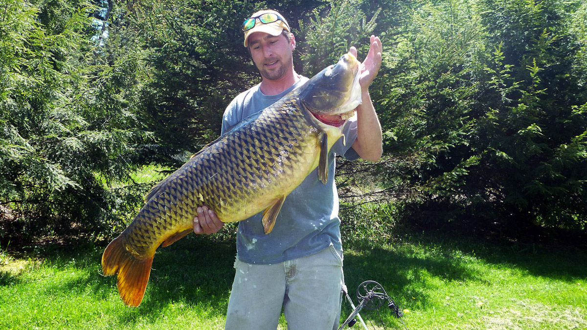 Darren Ouelette of Shoreham, Vt. with the new state record 44-lb. 6 oz. carp he caught recently in Lake Champlain.