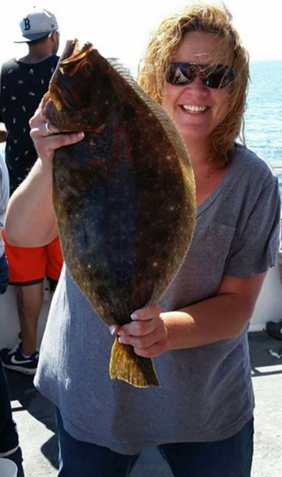 Amy Shugdinis with a 6-pound fluke taken while fishing aboard the Frances Fleet out of Narragansett.