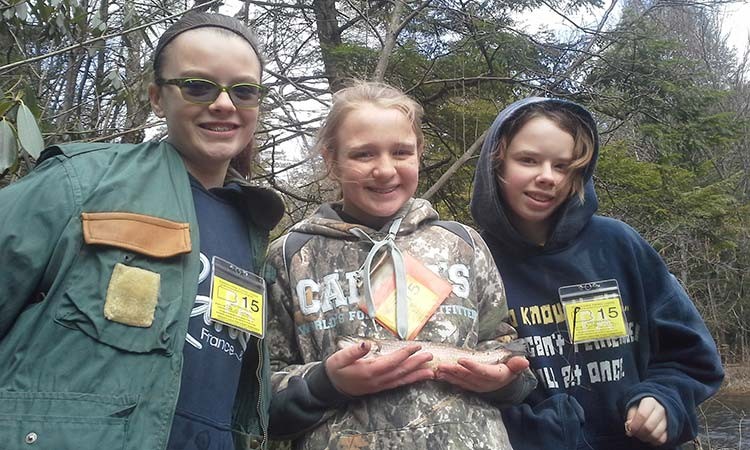 Ella, Haley, and Liz proudly displaying their &ldquo;voluntary youth fishing licenses&rdquo;, caught trout this past weekend during the Statewide Mentored Youth Trout Day.  Congratulations to each of you!!