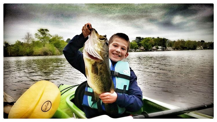 Ethan Ring, of Norton, MA, landed this impressive five-pounder from a kayak using a Texas-rigged senko in red shad color at the Norton Reservoir this past weekend.