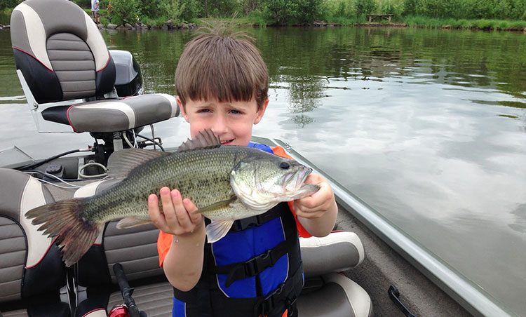Luke Szentesy with a nice bass he caught on Hammond Lake.