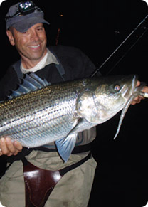 Ron Powers holds a Boston bass caught on on one of his fall favorites, a Bill Hurley Sand Eel.