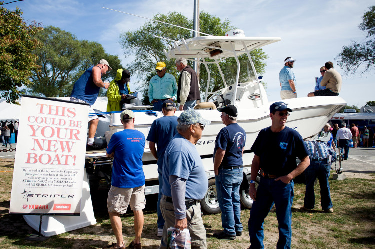 StriperFest attendees check out the Grand Prize Striper Boat and Yamaha Engine outfitted with Simrad Electronics.