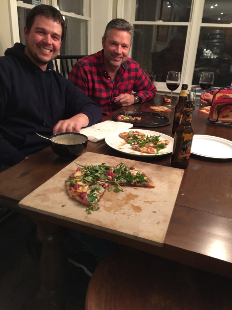 Jimmy Fee and Chris Megan chow down on the Dalat-inspired sashimi pizza.