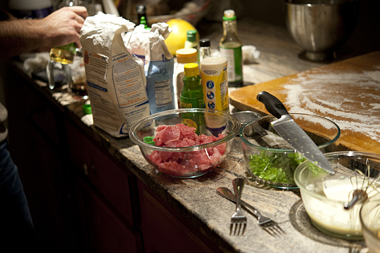 Thinly sliced pieces of bigeye wait to be added to the pizza "crust."