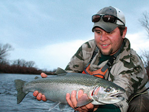Joe Cermele chased this male steelhead 50 yards down the bank before bringing it to the net.