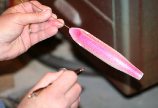 An airbrush is ideal for painting plugs