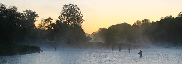 Hopeful anglers try their luck at sunrise on the Douglaston Salmon Run.