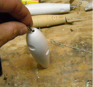 The nose grommet is inserted before the through-wire goes in.