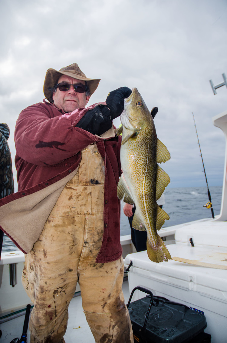 NAME with a fresh market cod from Coxes Ledge. 