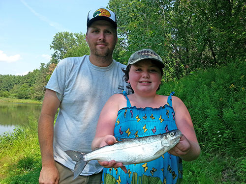 Montanah Latulippe of Winooski with her state record cisco she caught while fishing on Lake Champlain in 2015.