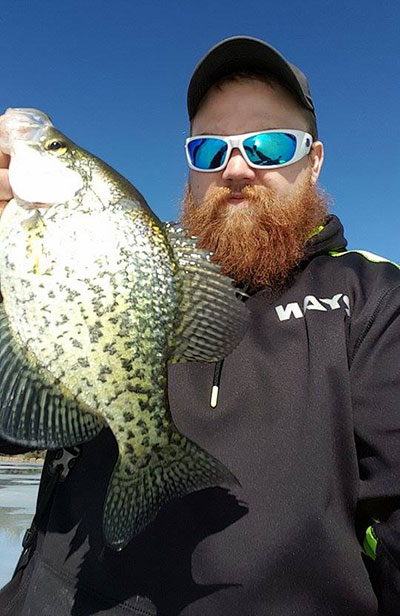 This past weekend was a great time on the ice for Ryan Bailey. Here he is with a Crappie caught during his day on the ice! (photo provided by angler)