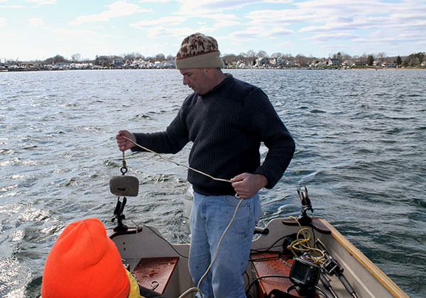 A “flounder pounder” is a drag-anchor that slows the boat’s drift and stirs up the muddy bottom, drawing in winter flounder.