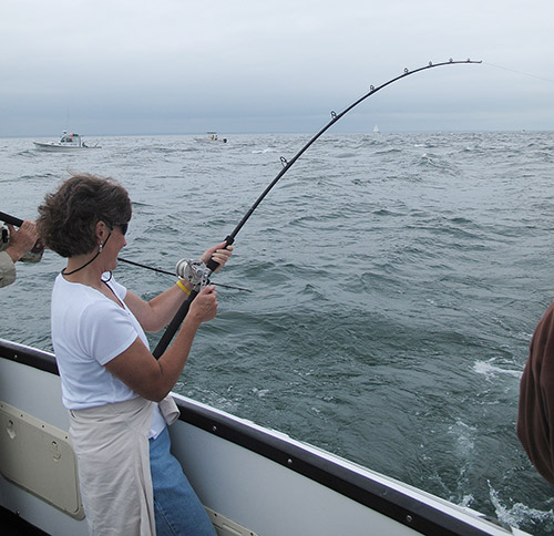 The old shell-squid trick tightens another line; this fish—after a five-minute battle—scaled 15 pounds.