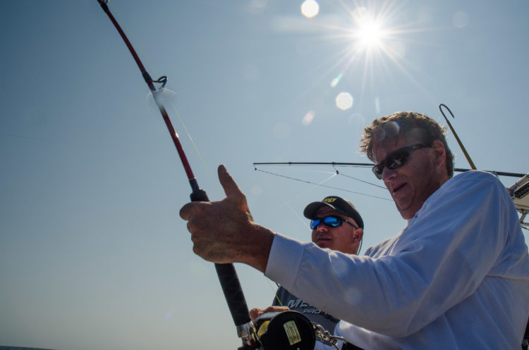 Captain Terry Nugent provides instruction while Jeff Parrish fights a 50-inch bluefin. 