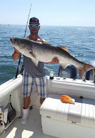 Andrew Jones with a solid 42-pound bass that one the Big Doug's Memorial Saltwater Shootout last weekend.