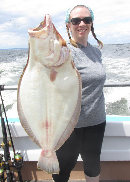 Danielle O'Brien with her second doormat of the year caught aboard the Elaine B. II.