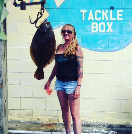 Dawn Johannsmeyer with the 13.5-pound fluke she caught in the Sandy Hook Channel.