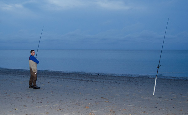 When fishing two rods, cast one bait close to the beach in case stripers are cruising next to shore, and frequently check and replace the baits.