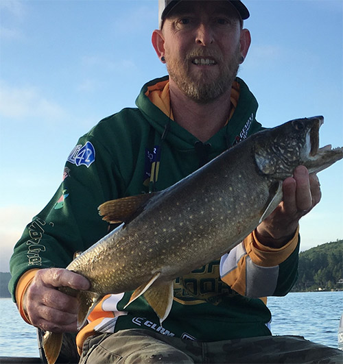 Tim Moore with a fat Winnipesauke lake trout.