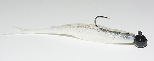 A Zoom Fluke on a jig head hopped and swam along bottom catches bass focused on baitfish.