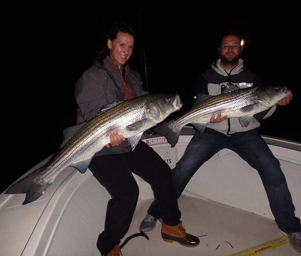 A nice striped bass double aboard Reel Cast Charters.