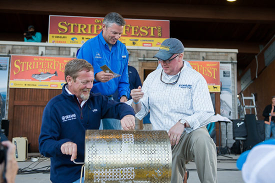 Yamaha's Dave *LNAME* and Century Boats's *NAME* dig through the Golden Tickets to select the 2016 StriperCup grand prize winner.