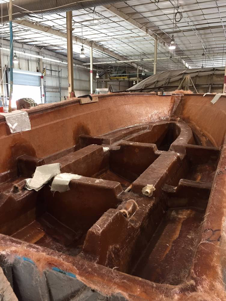 Adhering fiberblass - The beginning stages of the Century Boats build of the Striper Cup grand prize giveaway