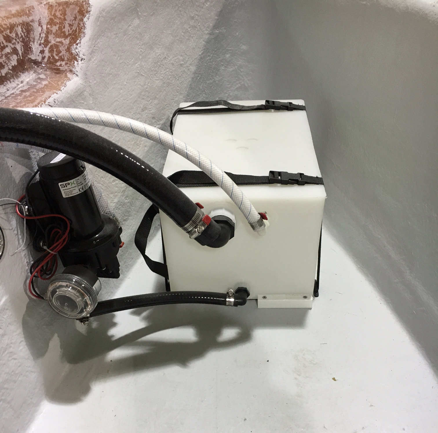 Before the deck goes in, take a peek at the 8 gallon fresh water tank featuring a Johnson Pump.