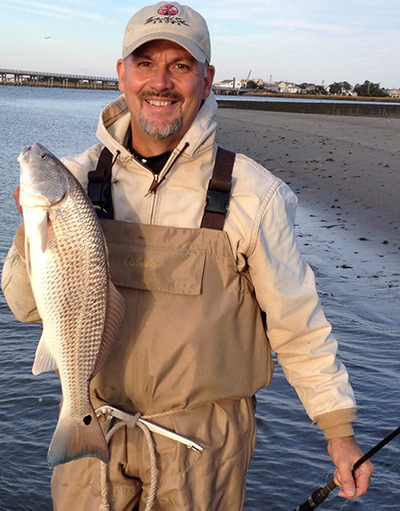 Fred Riddel waded a back bay sand flat to encounter this red.