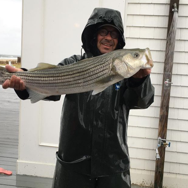 John Gates won the Monmouth Beach Striped Bass Classic with this 10-pound bass caught from the beach on clams.