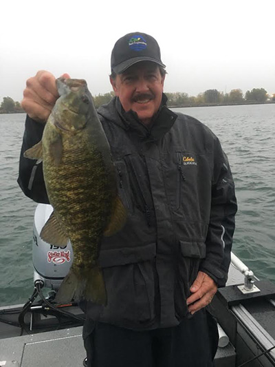 Nice Fall Bass caught by John Reid of Virginia while fishing with Capt. Chris Cinelli of Grand Island.