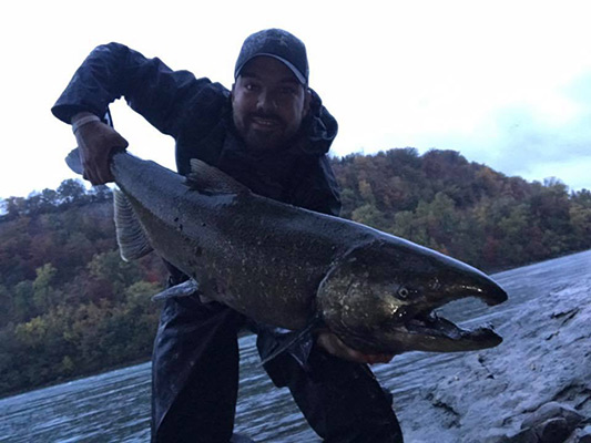 Ricardo Davila with a big river king salmon
