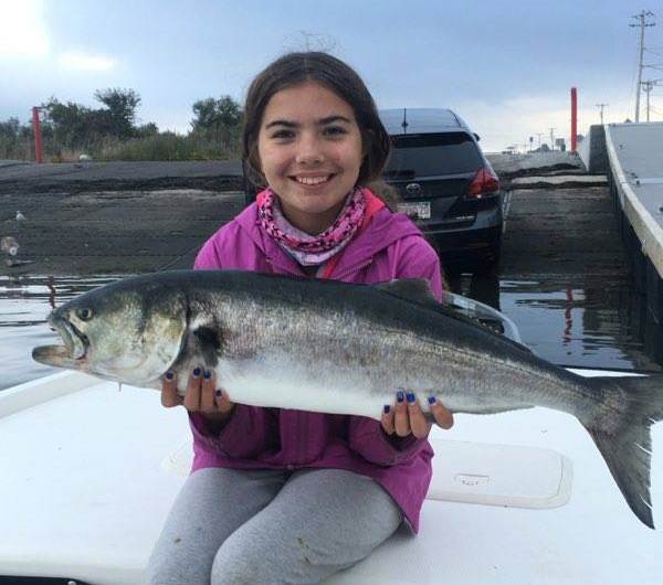 Young Sophia Garzoli topped off an epic multi-species day with this monster bluefish.