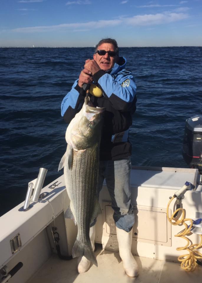 The Dock Outfitters said bunker spoons are the best bet for big bass like this 45-pounder caught by Mike Tutela.