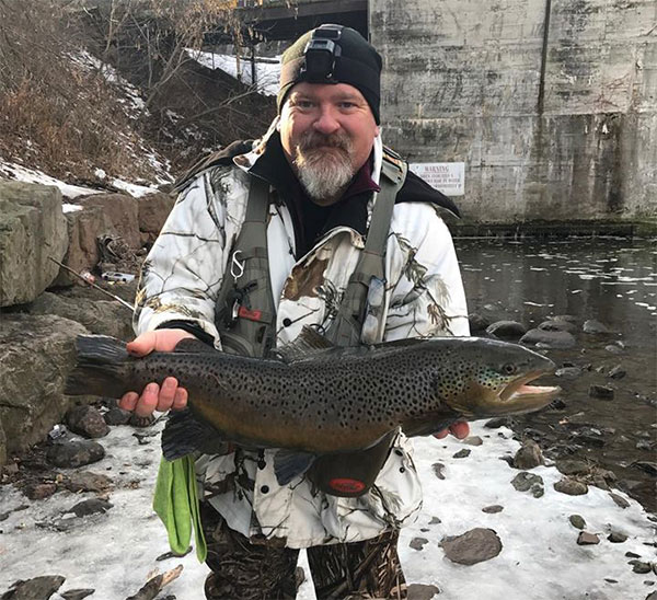 Greg Schloerb of Amerhest 10.7 pound brown at Burt Dam