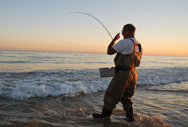 A sinking line and a big streamer helped connect this angler with a big beach striper.